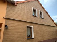 Vorgeh&auml;ngte hinterl&uuml;ftete Fassade Vinylit Holzoptik, Sanierungsbau Weiz